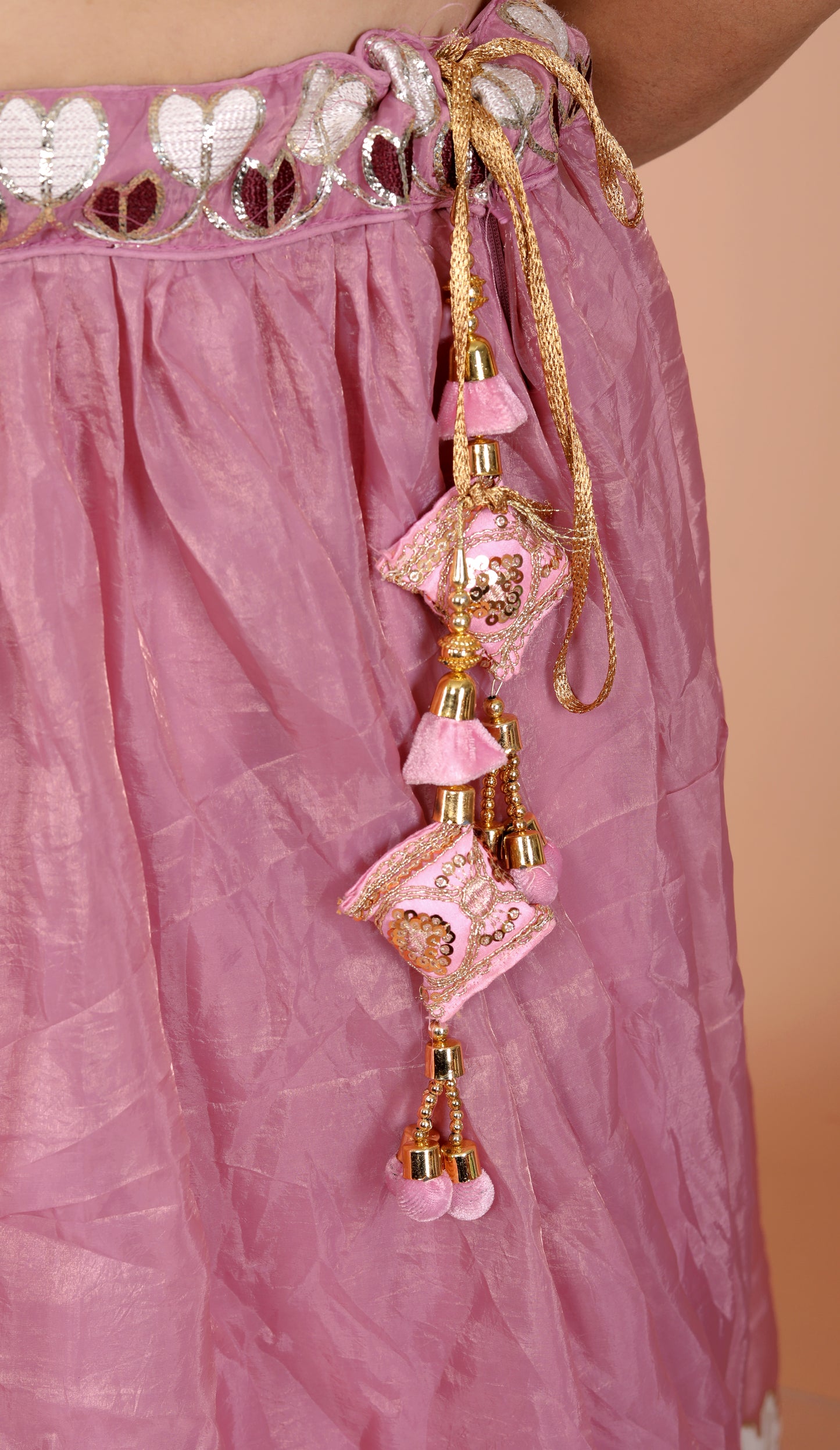 CRUSH TISSUE APPLIQUE WORK ONION PINK LEHNGA BY SKFBHOLUBHAI