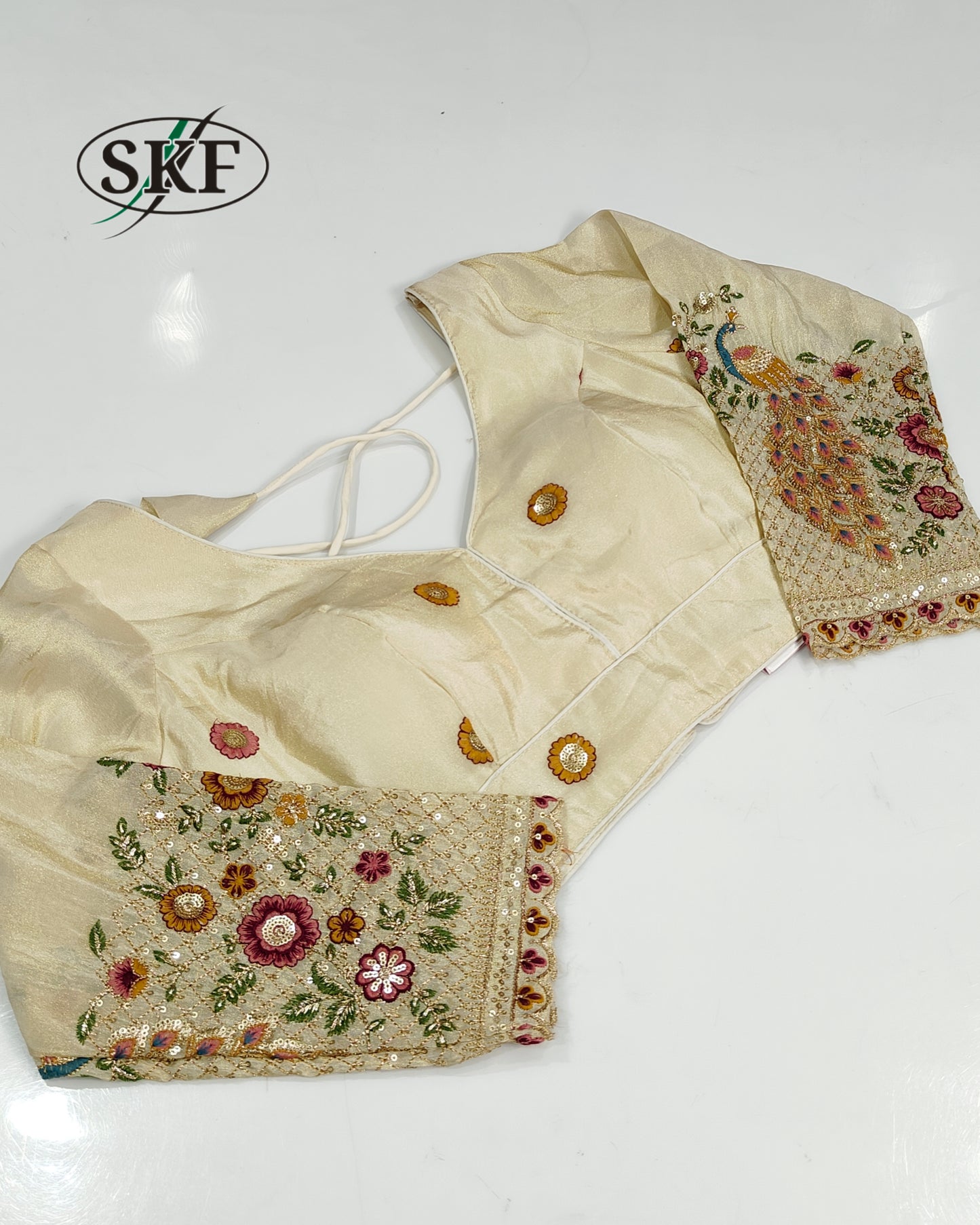 TISSUE EMBROIDERY SEQUENCE GOLDEN IVORY BLOUSE BY SKFBHOLUBHAI