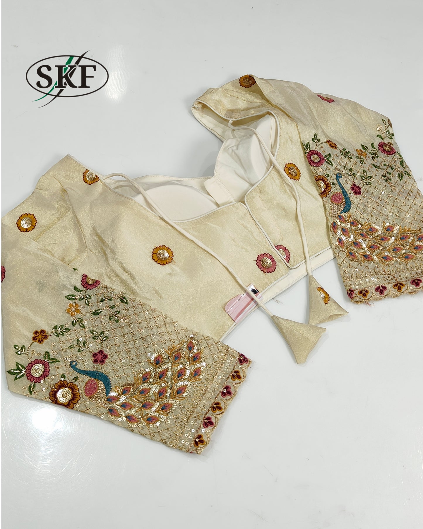 TISSUE EMBROIDERY SEQUENCE GOLDEN IVORY BLOUSE BY SKFBHOLUBHAI