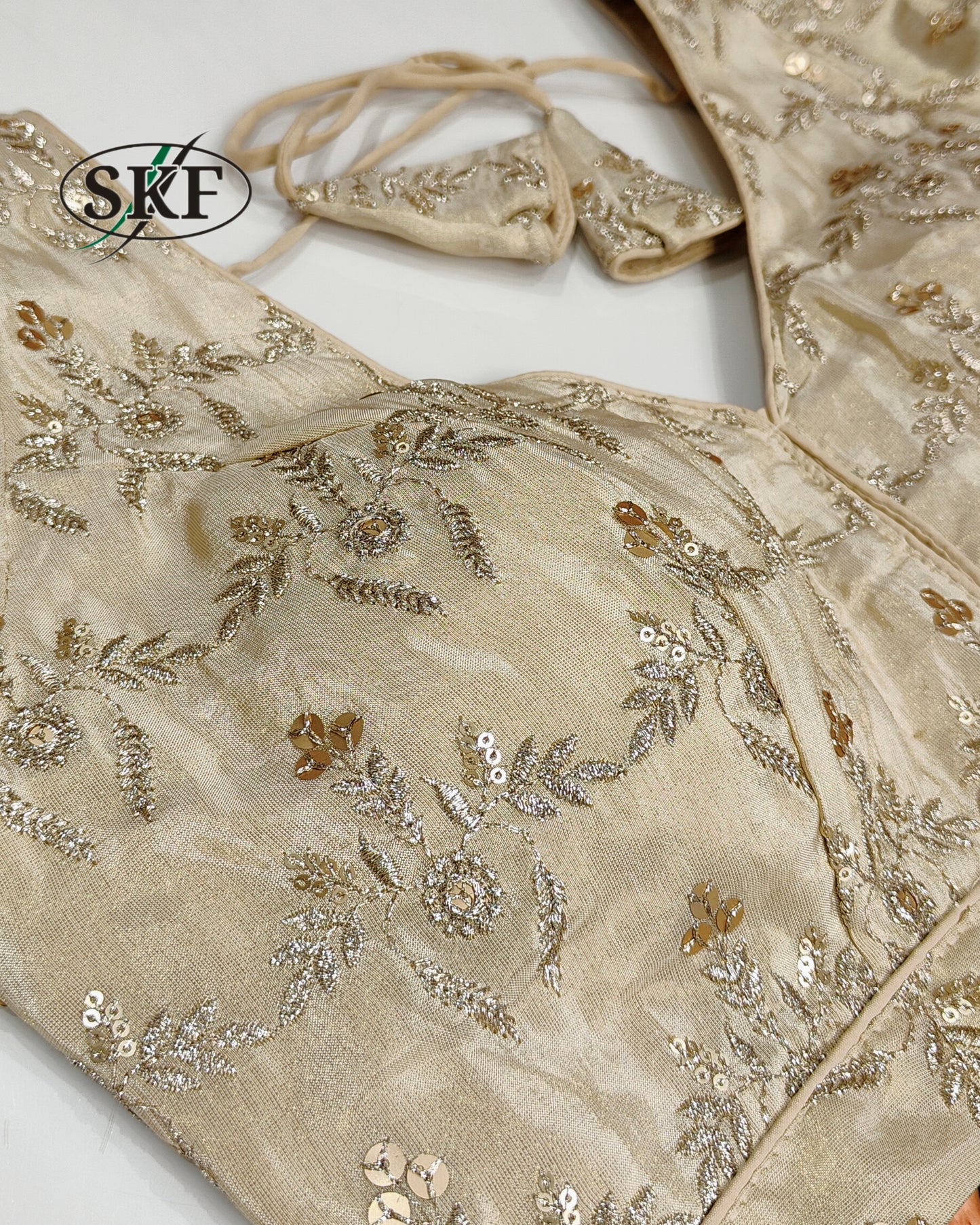 TISSUE SEQUENCE EMBROIDERY GOLDEN BEIGE BLOUSE BY SKFBHOLUBHAI