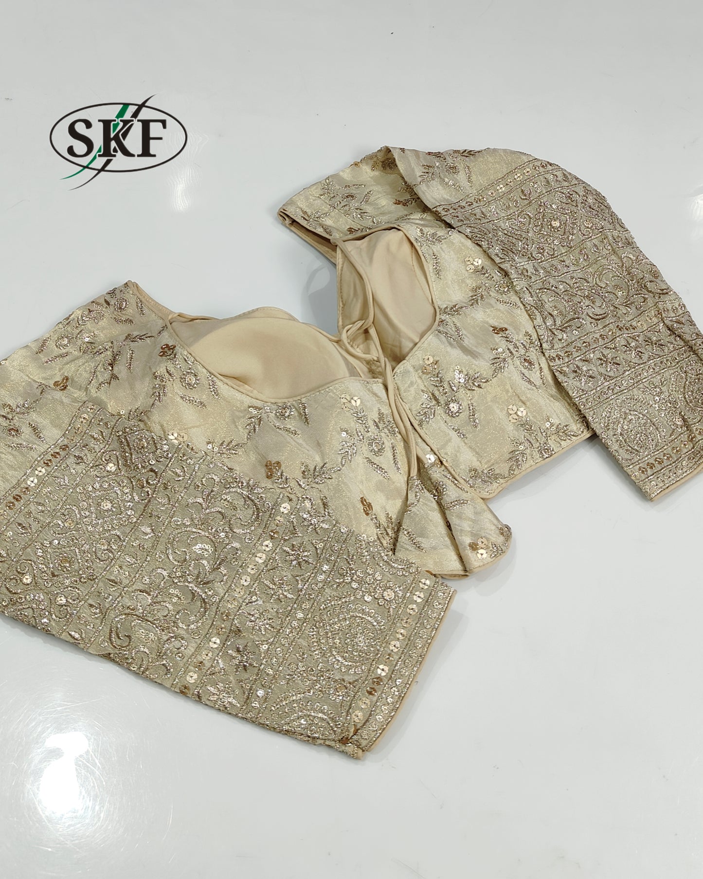 TISSUE SEQUENCE EMBROIDERY GOLDEN BEIGE BLOUSE BY SKFBHOLUBHAI