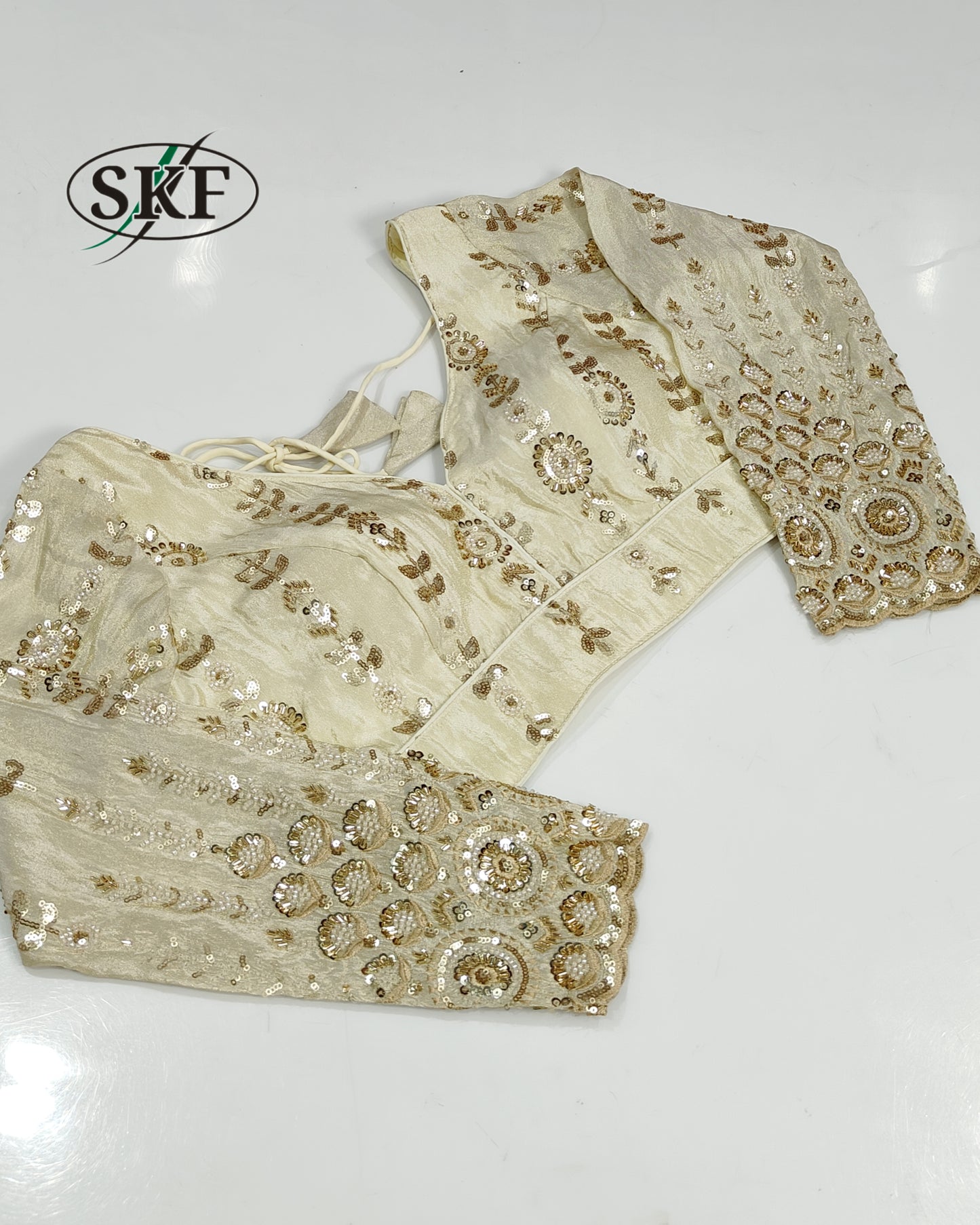 TISSUE HANDWORK SEQUENCE GOLDEN IVORY BLOUSE BY SKFBHOLUBHAI