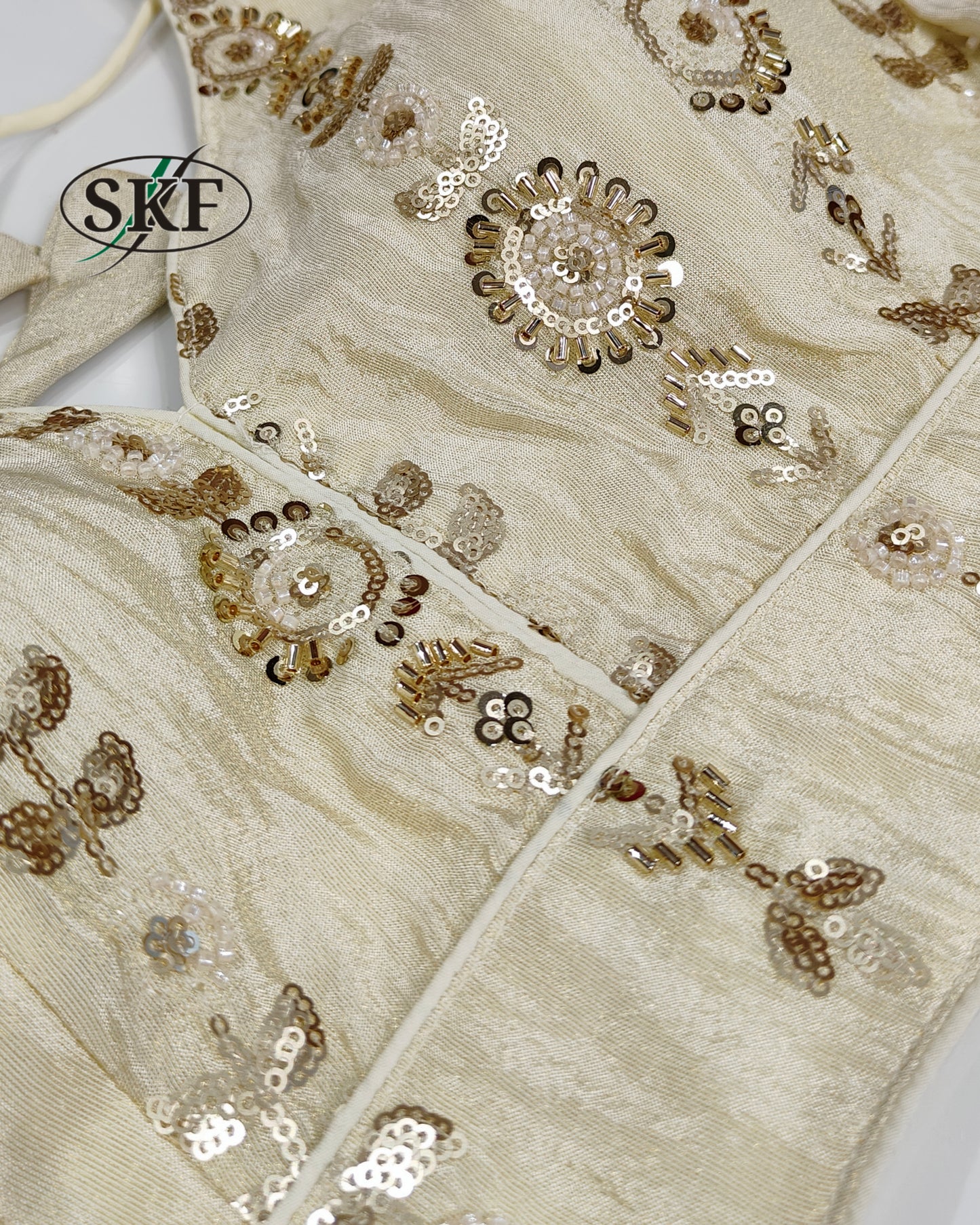 TISSUE HANDWORK SEQUENCE GOLDEN IVORY BLOUSE BY SKFBHOLUBHAI