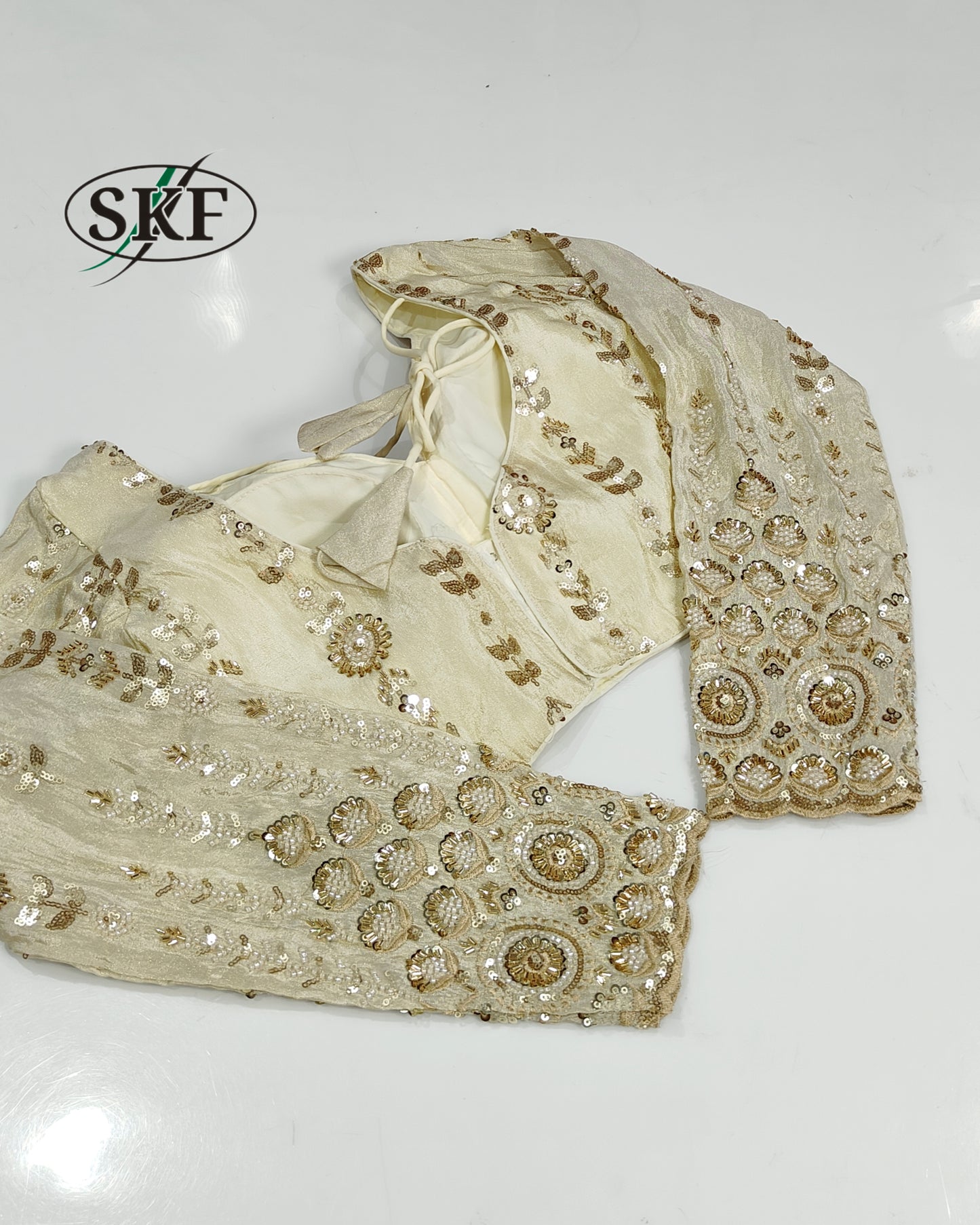 TISSUE HANDWORK SEQUENCE GOLDEN IVORY BLOUSE BY SKFBHOLUBHAI