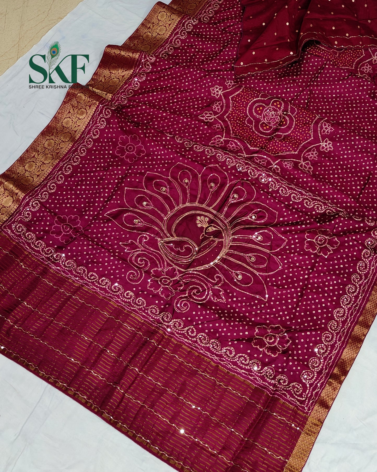 HO SILK BHANDHANI PEACOCK MOTIF AARI AND SEQUENCE WORK WINE SAREE BY SKFBHOLUBHAI
