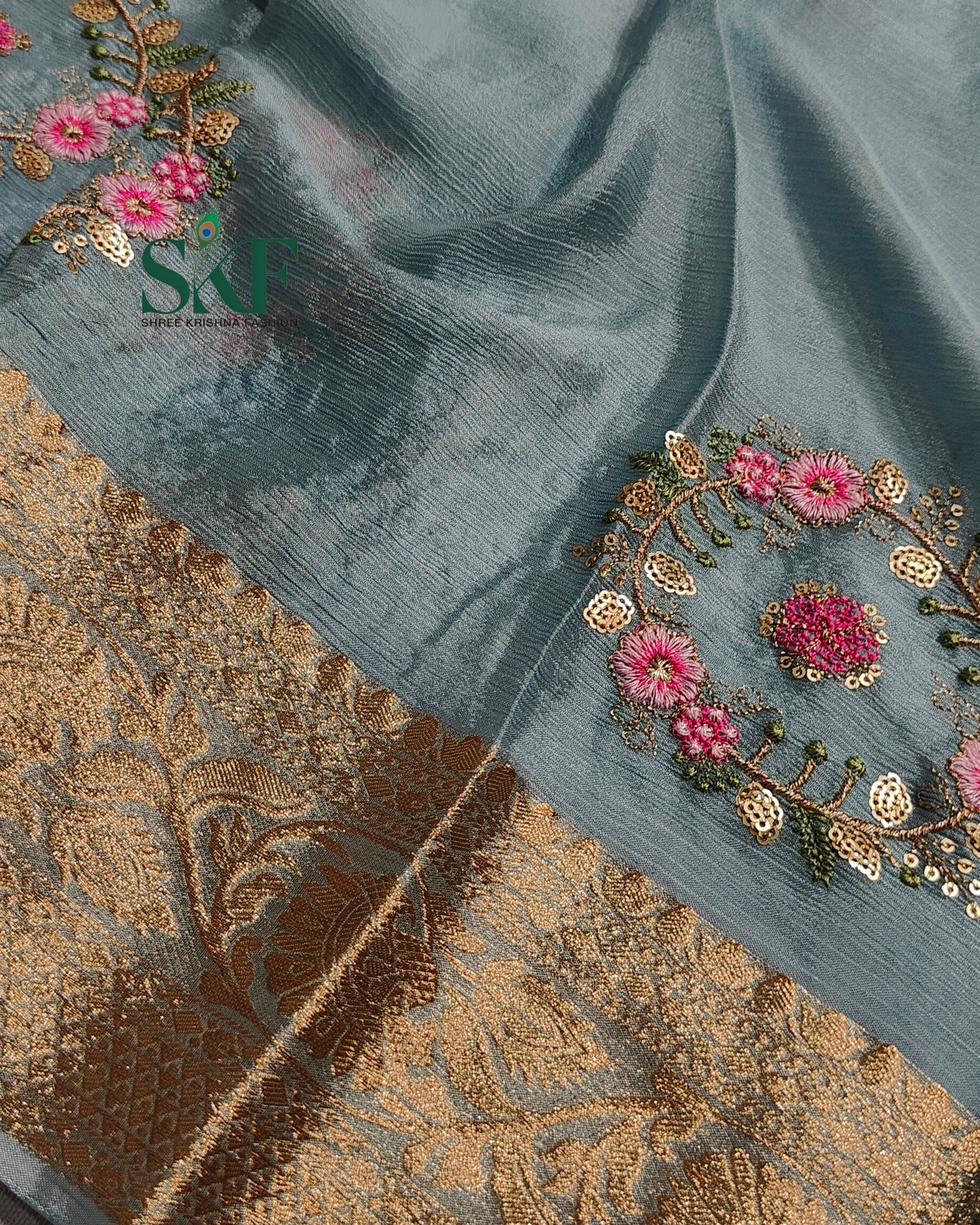 CHINON SEQUENCE EMBROIDERY WEAVING WORK ICE BLUE SAREE BY SKFBHOLUBHAI