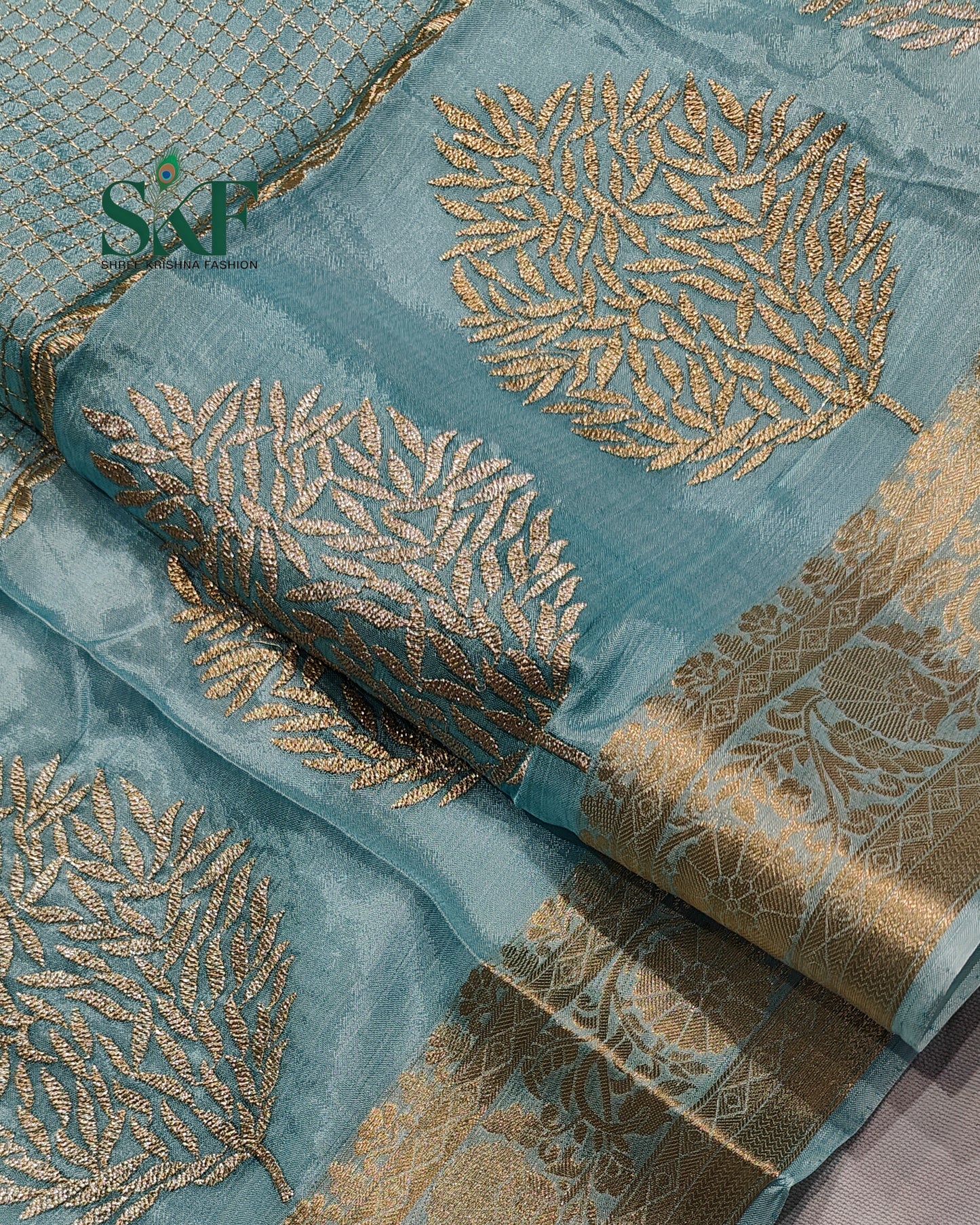 CHINON EMBROIDERY WEAVING BORDER WORK ICEBLUE SAREE BY SKFBHOLUBHAI