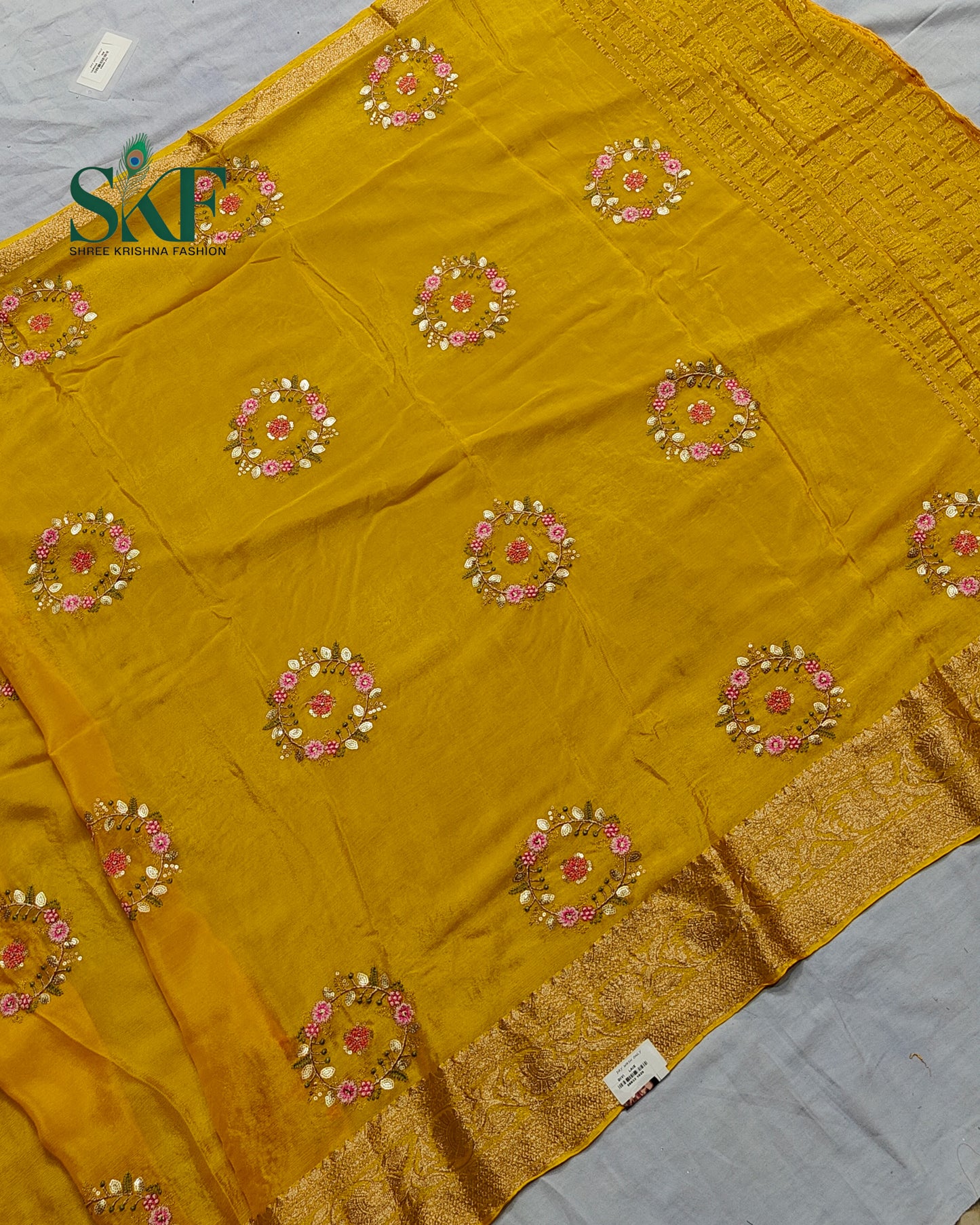 CHINON SEQUENCE EMBROIDERY WEAVING WORK YELLOW SAREE BY SKFBHOLUBHAI