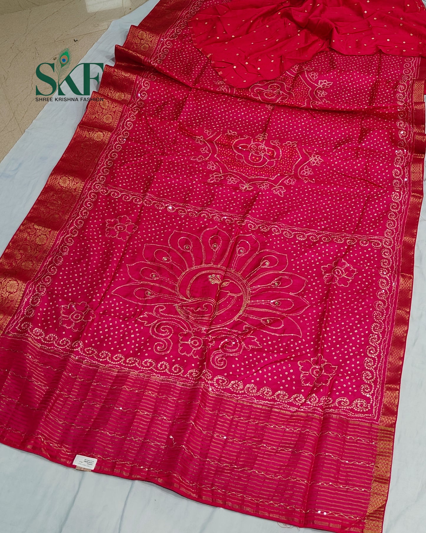 HO SILK BHANDHANI PEACOCK MOTIF AARI AND SEQUENCE WORK RANIPINK SAREE BY SKFBHOLUBHAI