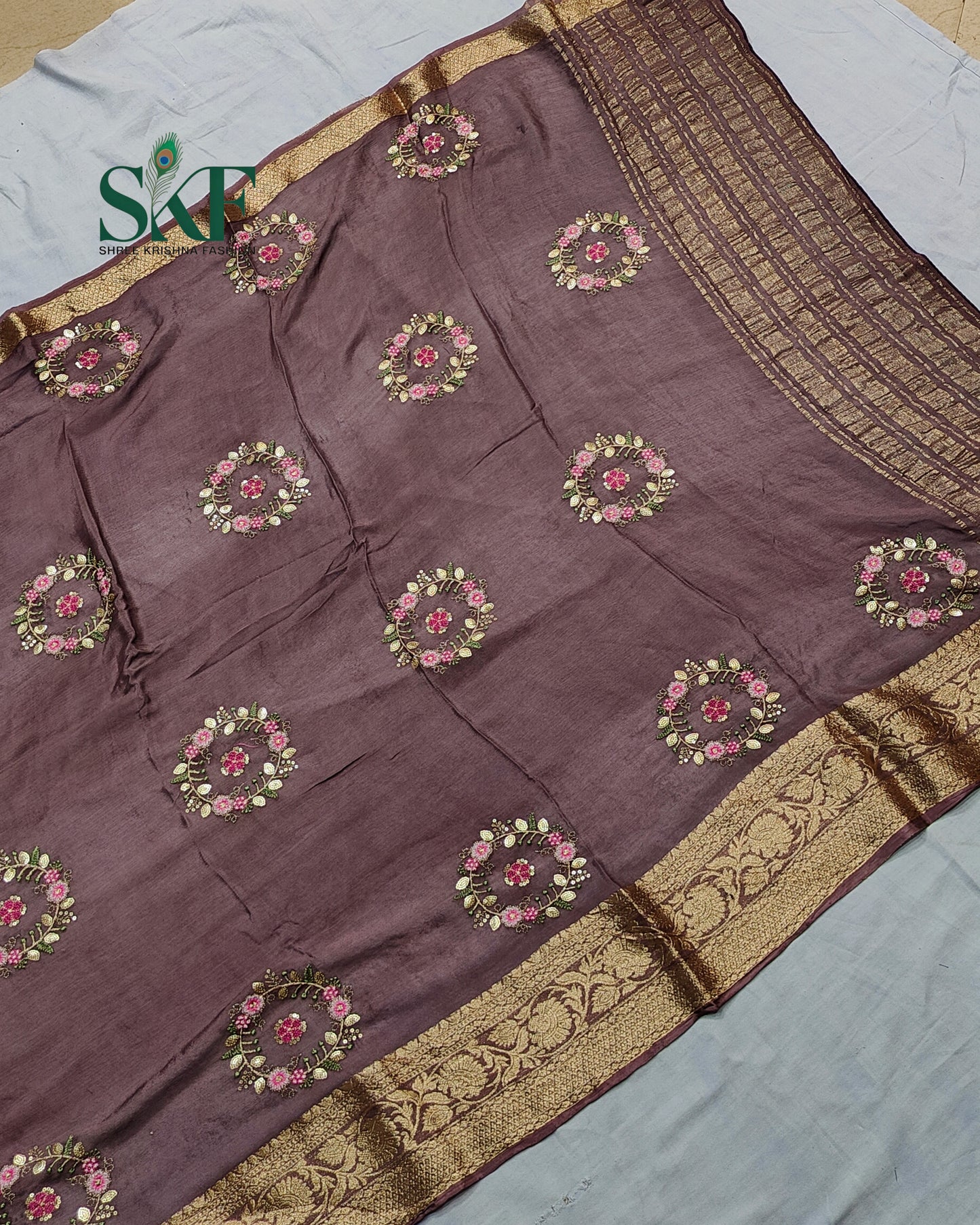 CHINON SEQUENCE EMBROIDERY WEAVING WORK LILAC SAREE BY SKFBHOLUBHAI