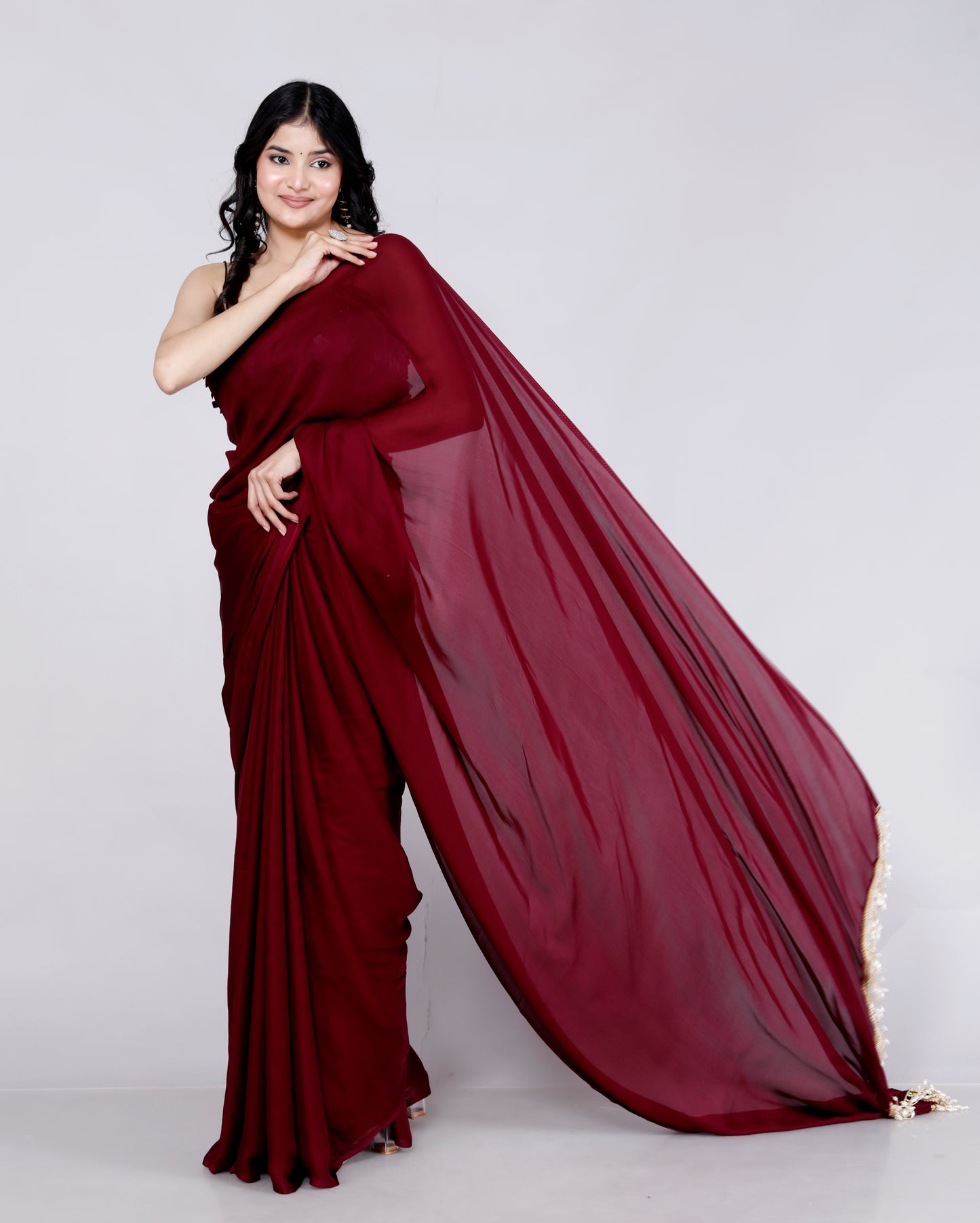 CREPE PLAIN TASSELS WORK MAHROON SAREE BY SKFBHOLUBHAI