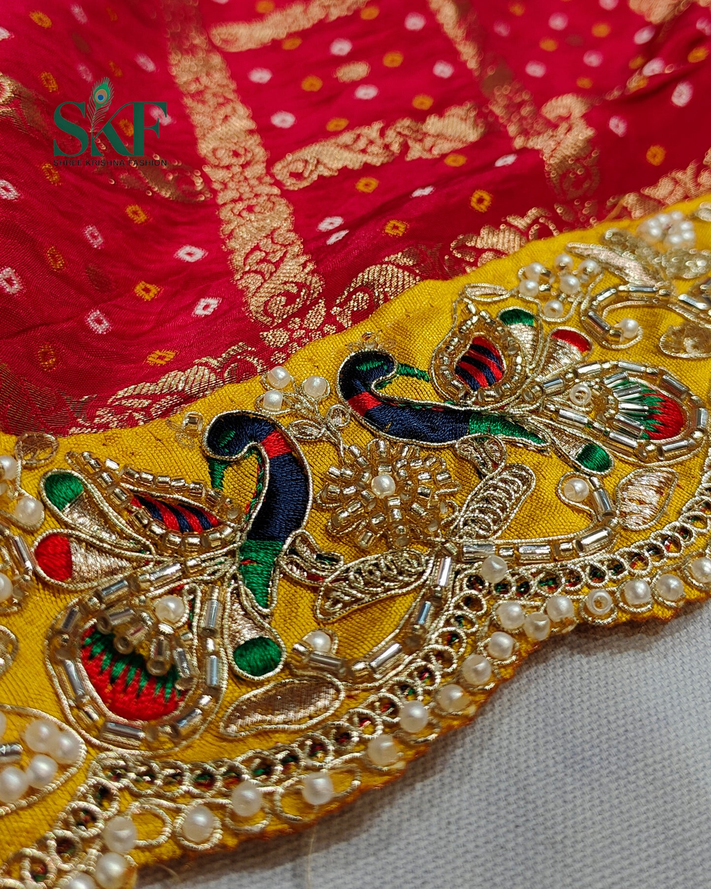 KHADI NEEM JARI GEORGETTE GHATCHOLA BHANDHANI HEAVY WORK BORDER RED SAREE BY SKFBHOLUBHAI