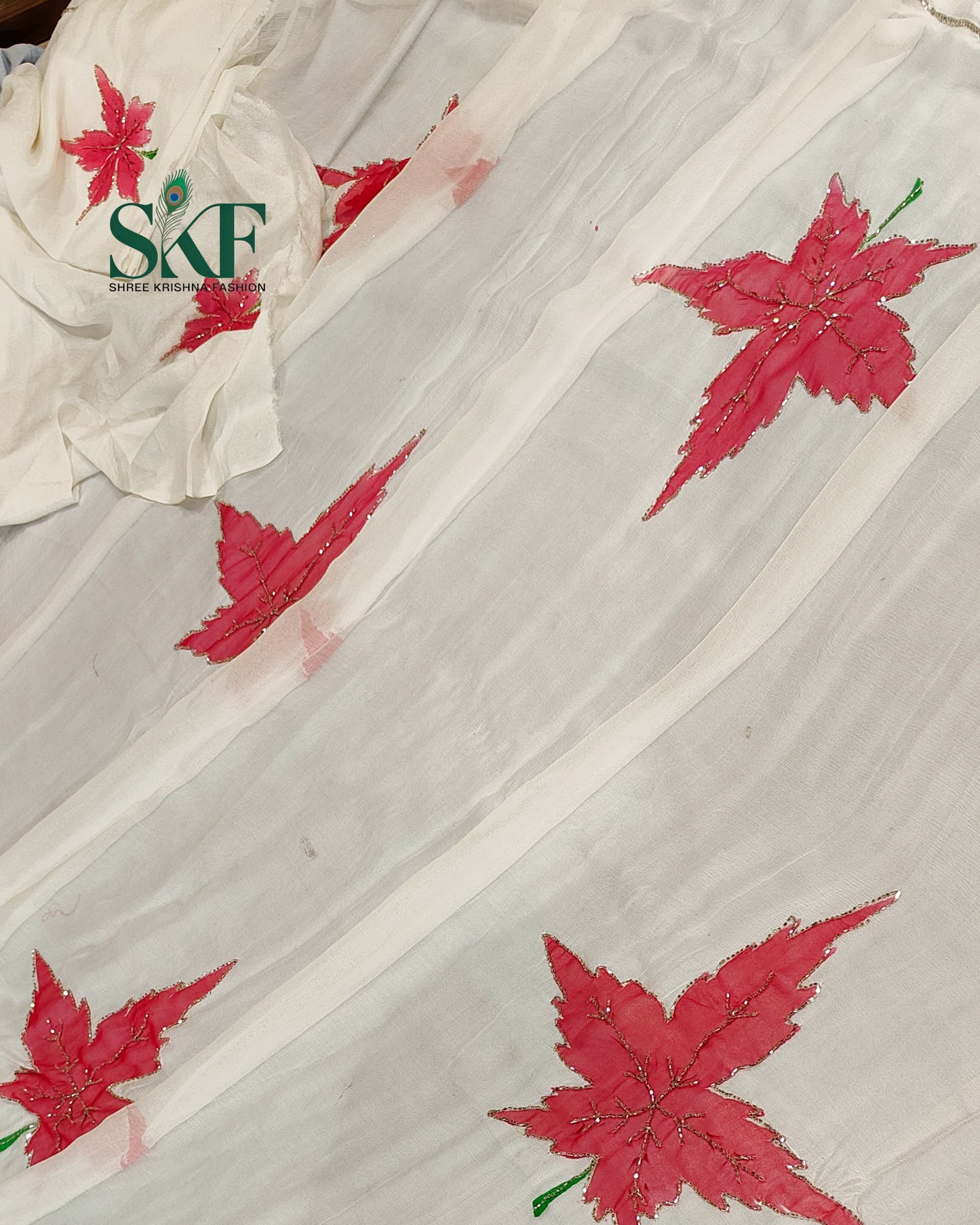 CHIFFON BRUSH PRINT LEAF KARDANA HANDWORK BUTTY WHITE SAREE BY SKFBHOLUBHAI