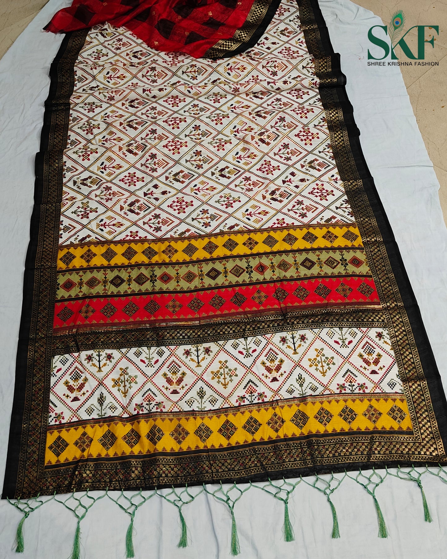 MAURA SILK PATOLA FOIL PRINT WEAVING IVORY SAREE BY SKFBHOLUBHAI