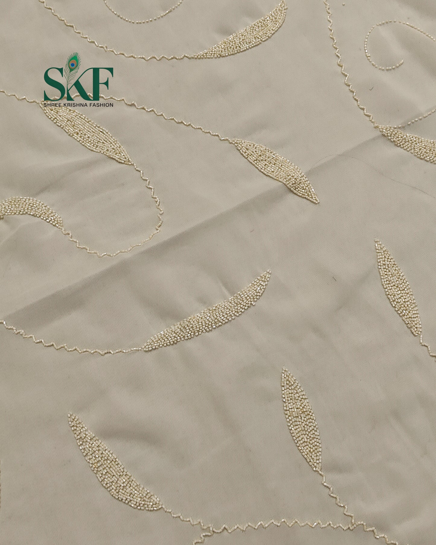 GEORGETTE IVORY KARDANA JAAL HANDWORK SAREE BY SKFBHOLUBHAI