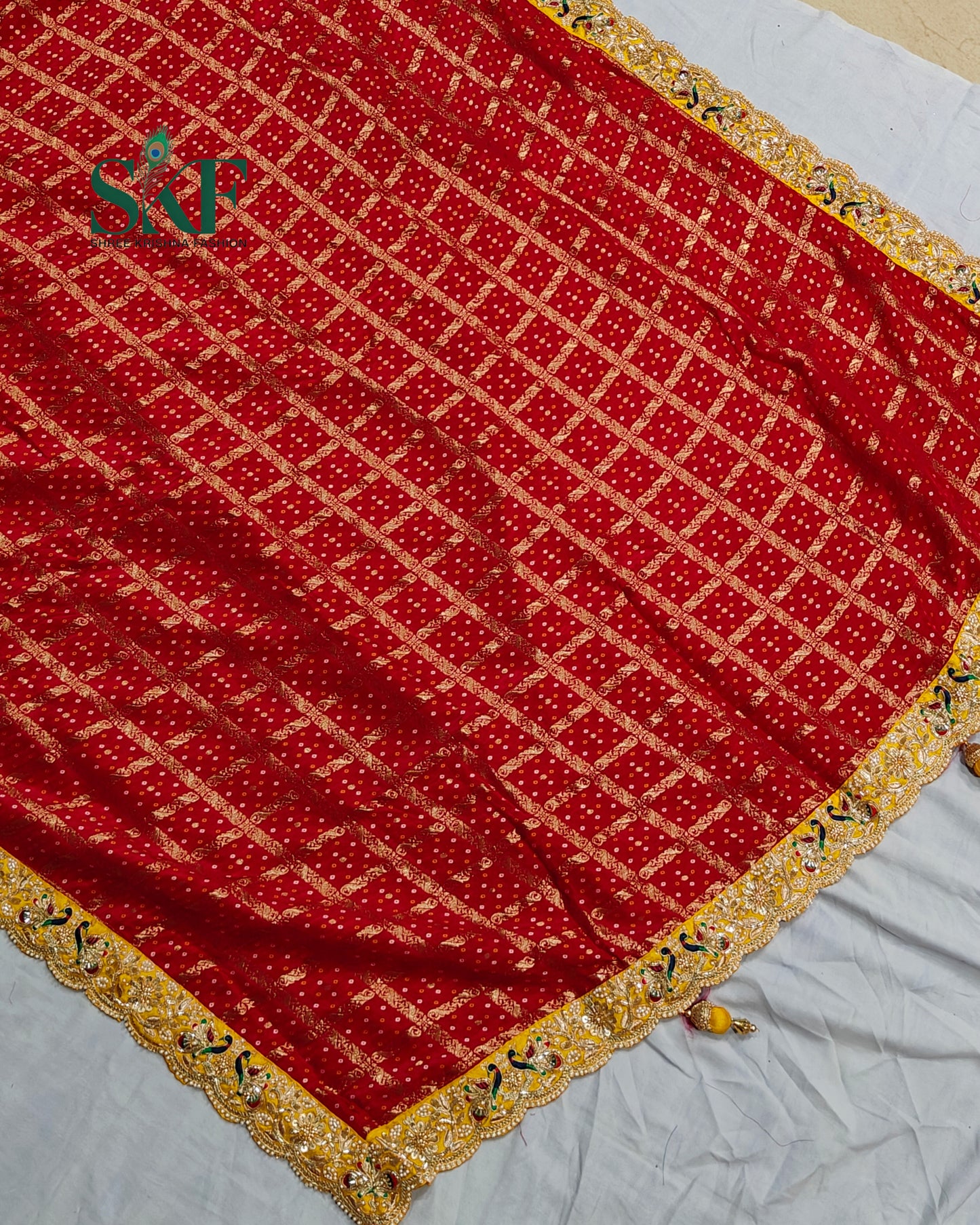 KHADI NEEM JARI GEORGETTE GHATCHOLA BHANDHANI HEAVY WORK BORDER RED SAREE BY SKFBHOLUBHAI