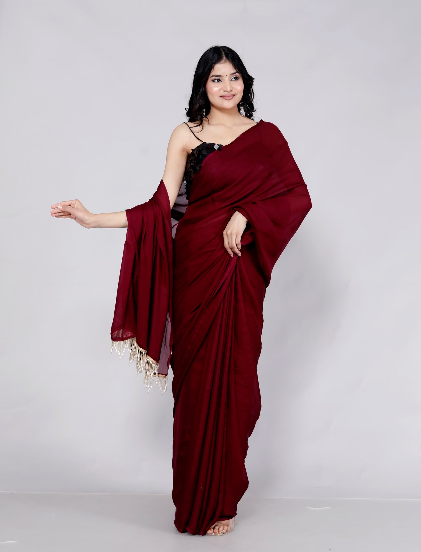 CREPE PLAIN TASSELS WORK MAHROON SAREE BY SKFBHOLUBHAI