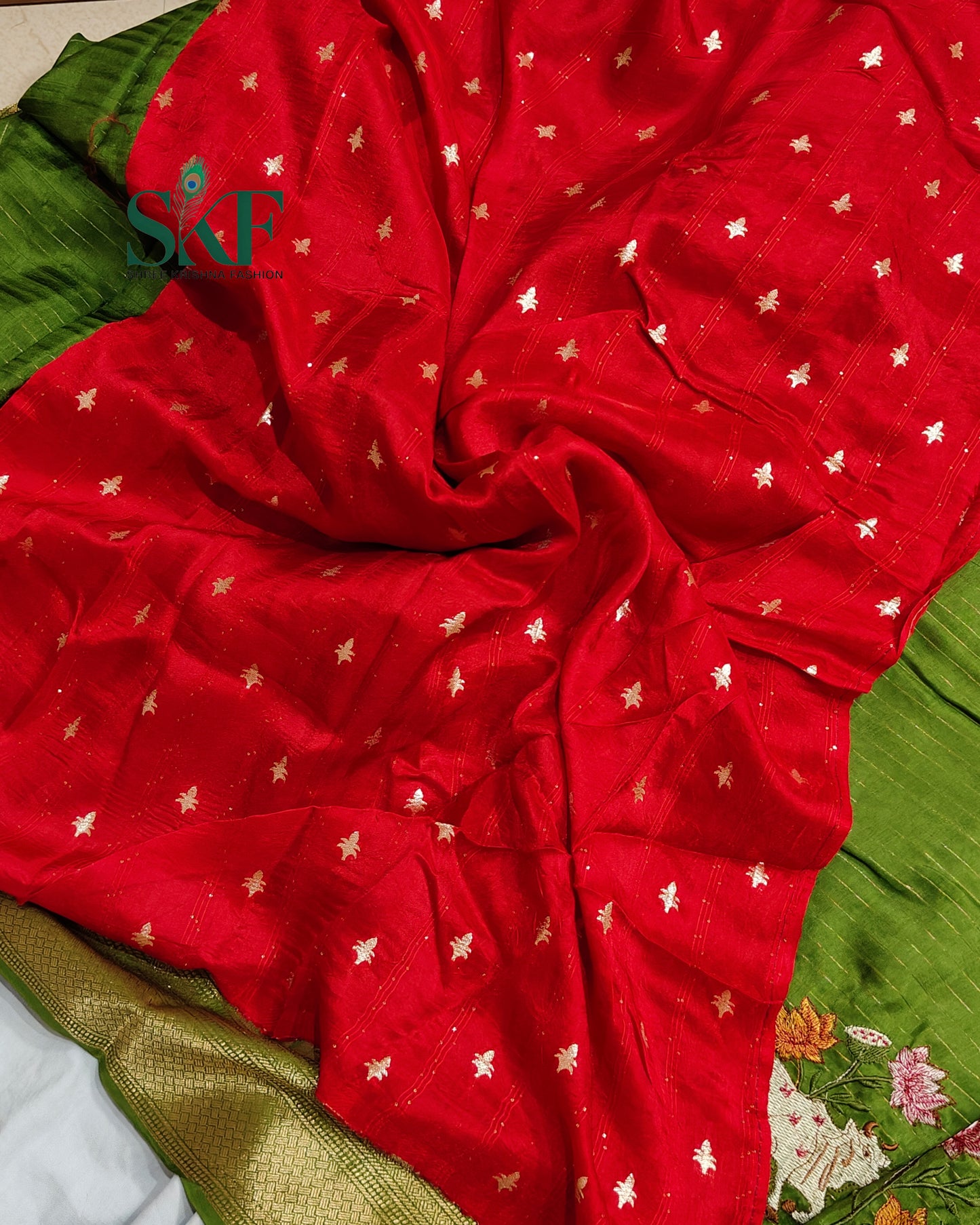 DOLA SILK MOTIF EMBROIDERY PANEL WEAVING BORDER WORK MEHNDI GREEN SAREE BY SKFBHOLUBHAI