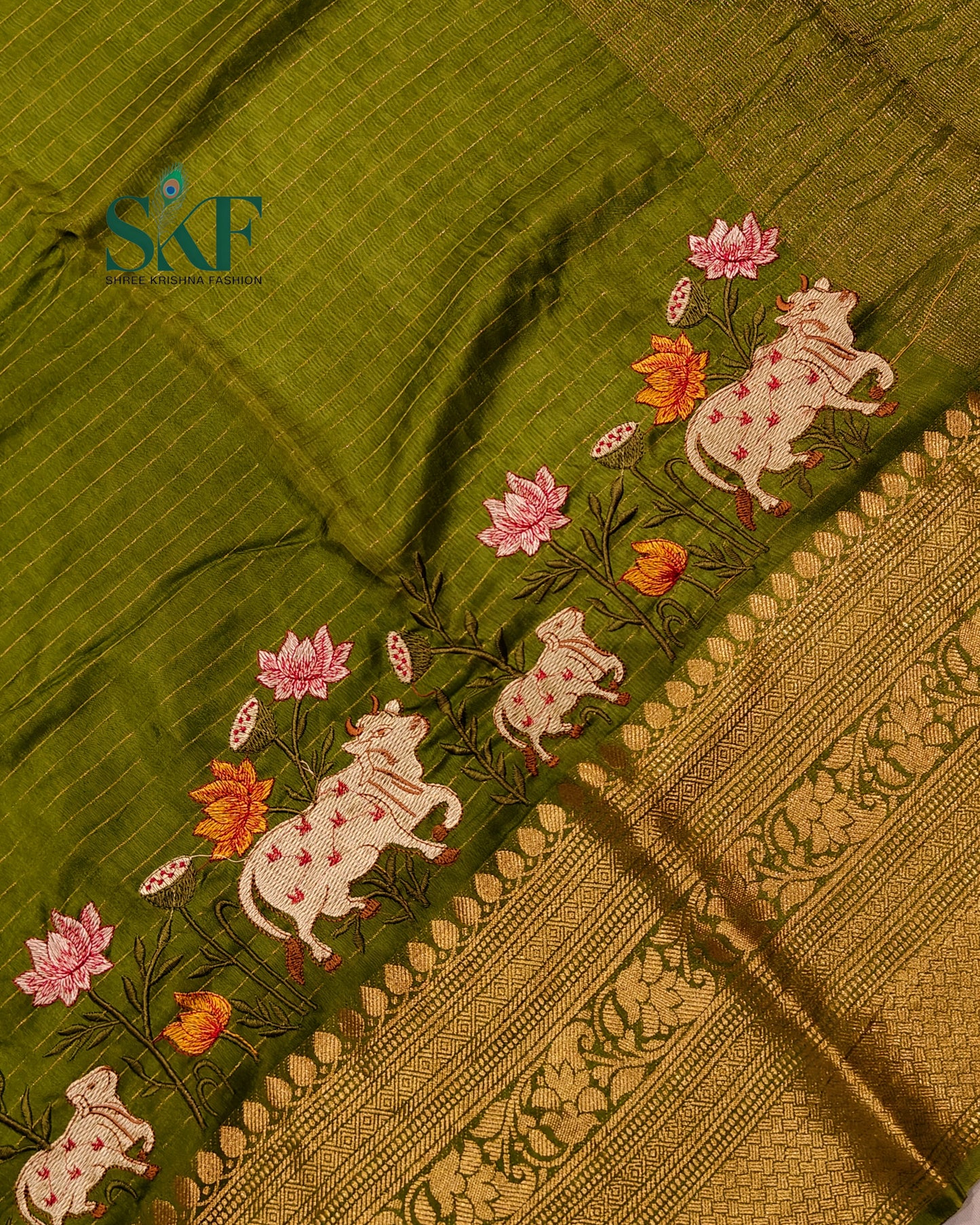 DOLA SILK MOTIF EMBROIDERY PANEL WEAVING BORDER WORK MEHNDI GREEN SAREE BY SKFBHOLUBHAI