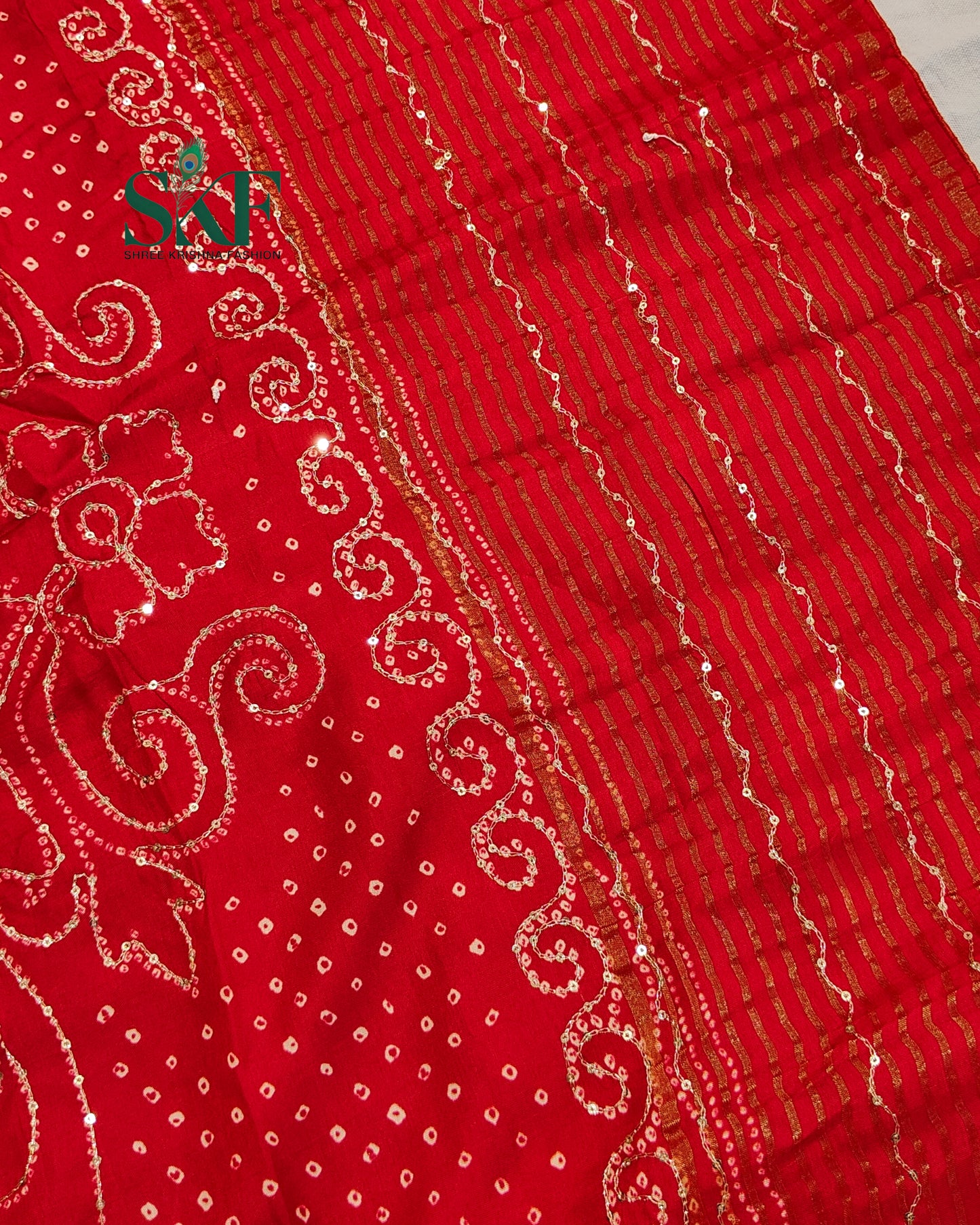HO SILK BHANDHANI PEACOCK MOTIF AARI AND SEQUENCE WORK RED SAREE BY SKFBHOLUBHAI