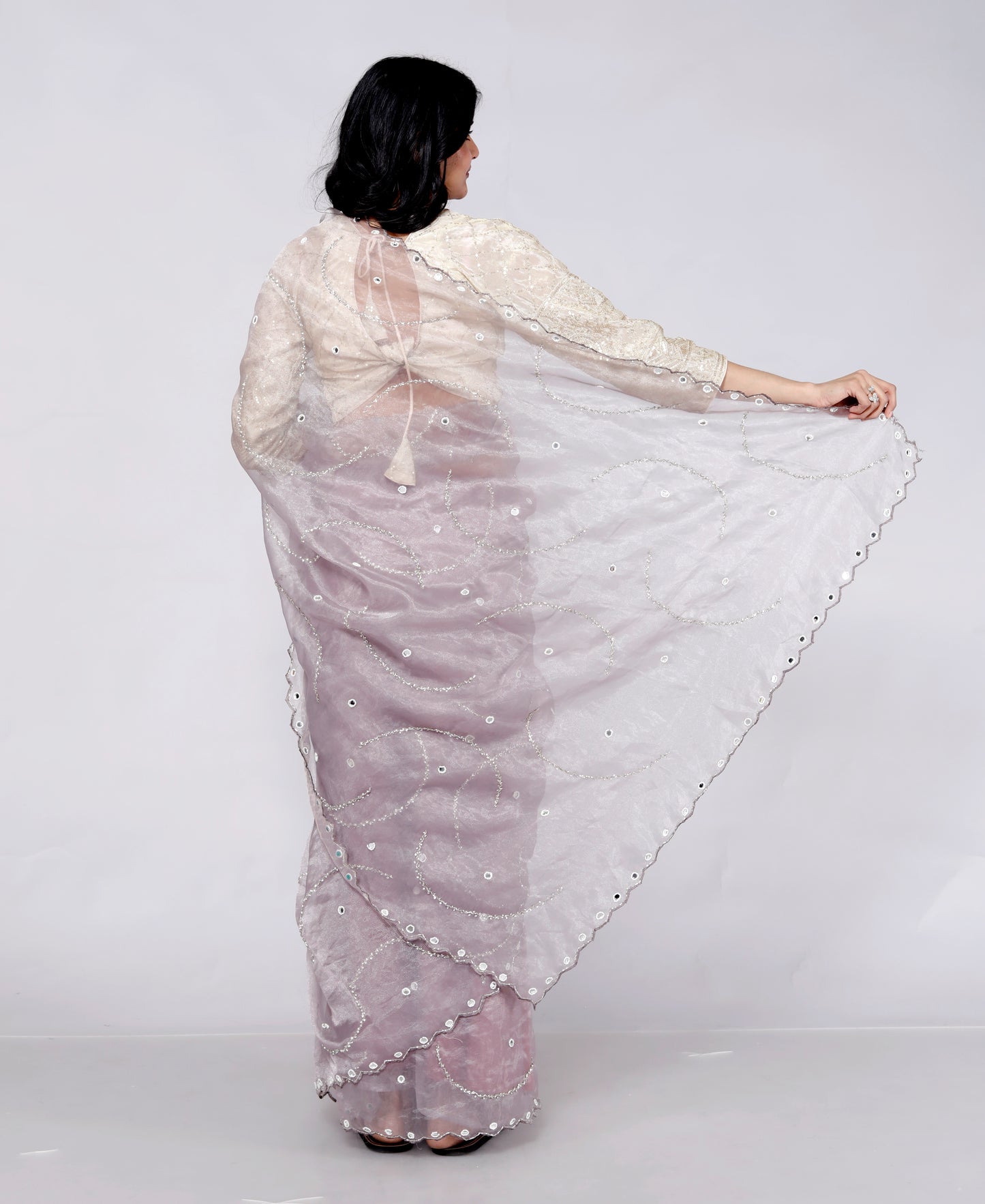 GLOSSY ORGANZA MIRROR AND JERKEN HANDWORK LILAC SAREE BY SKFBHOLUBHAI