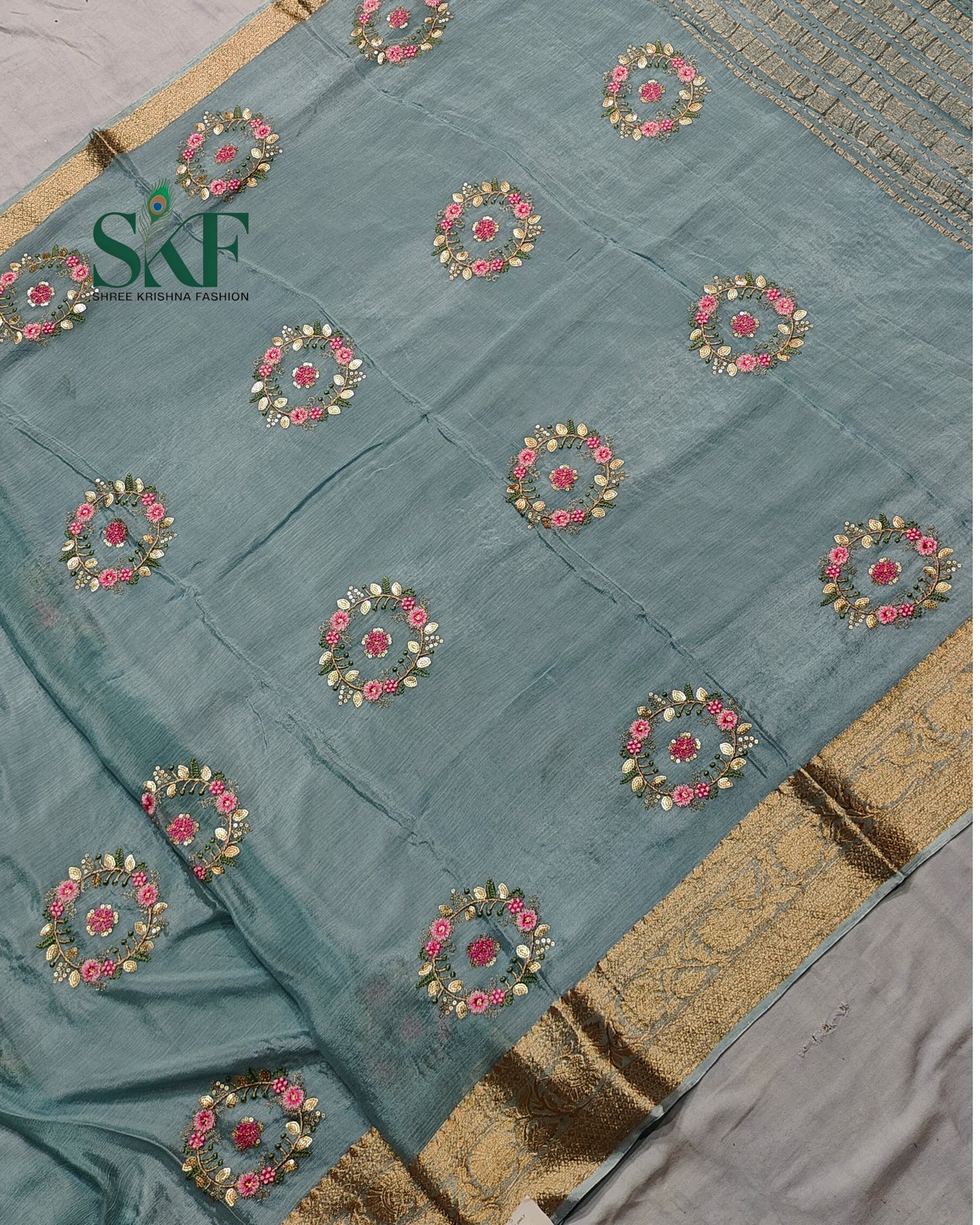 CHINON SEQUENCE EMBROIDERY WEAVING WORK ICE BLUE SAREE BY SKFBHOLUBHAI