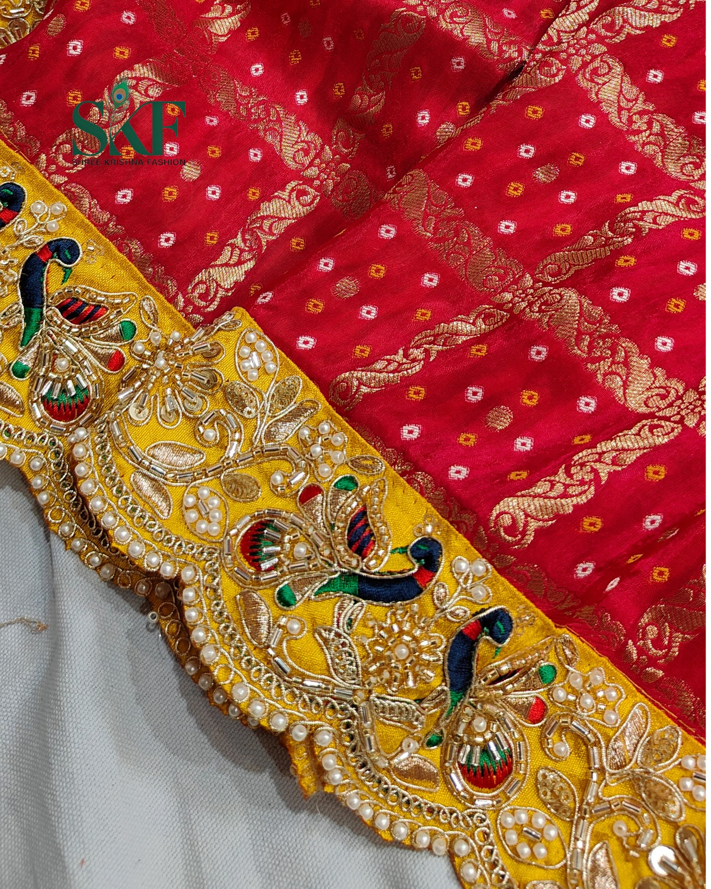 KHADI NEEM JARI GEORGETTE GHATCHOLA BHANDHANI HEAVY WORK BORDER RED SAREE BY SKFBHOLUBHAI