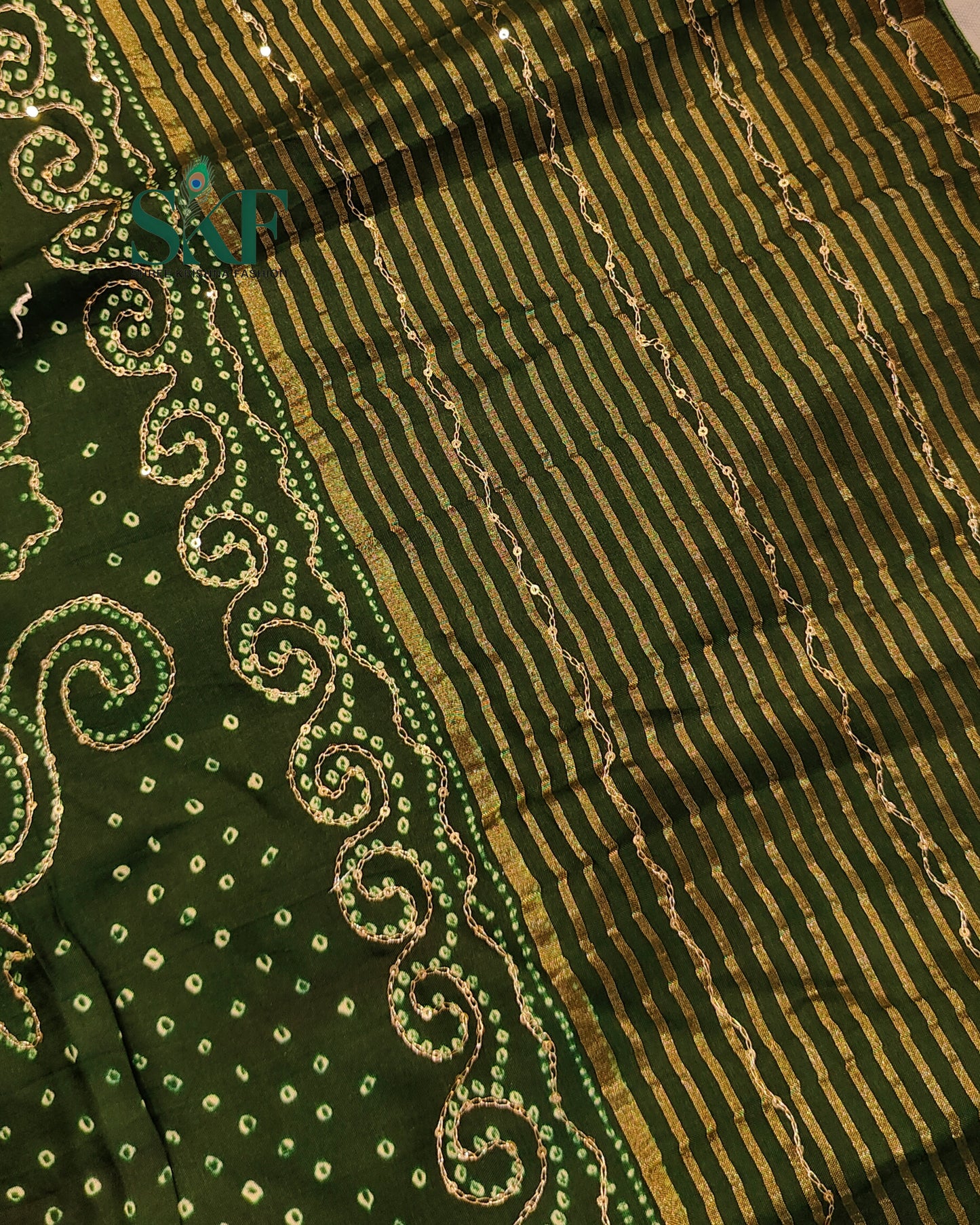 HO SILK BHANDHANI PEACOCK MOTIF AARI AND SEQUENCE WORK BOTTLE GREEN SAREE BY SKFBHOLUBHAI