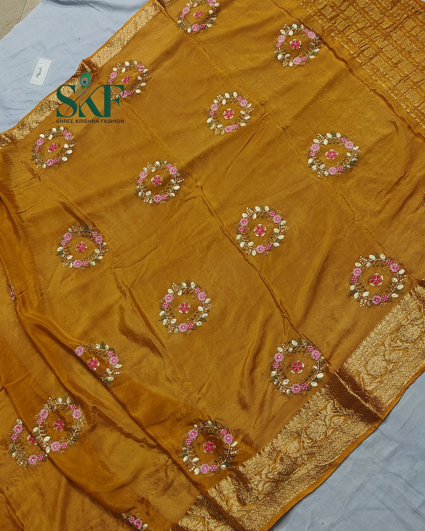 CHINON SEQUENCE EMBROIDERY WEAVING WORK MUSTARD SAREE BY SKFBHOLUBHAI