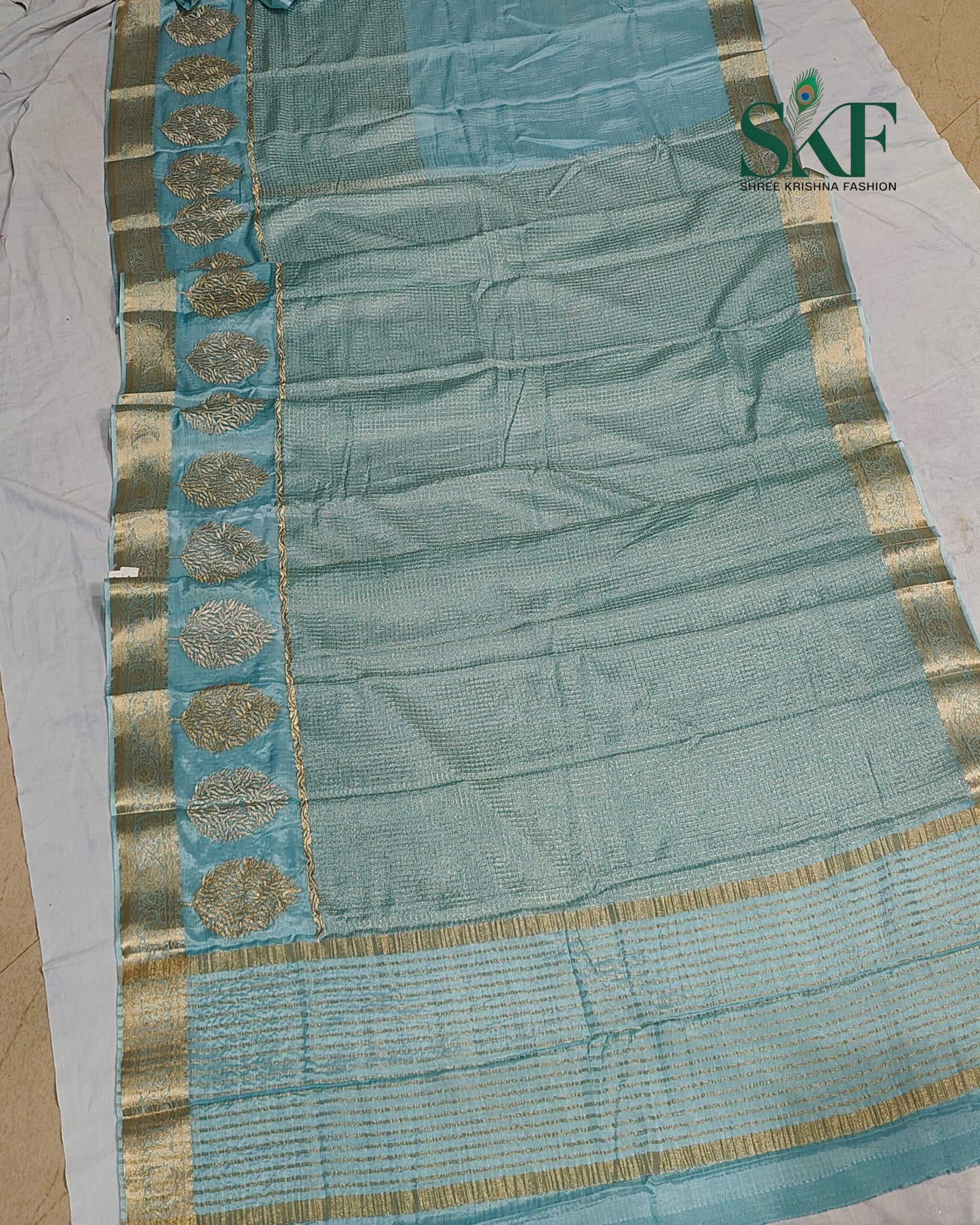 CHINON EMBROIDERY WEAVING BORDER WORK ICEBLUE SAREE BY SKFBHOLUBHAI