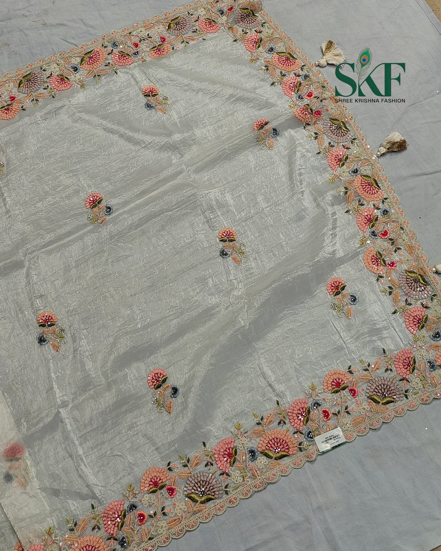 CRUSH TISSUE SIPPI SEQUENCE EMBROIDERY WORK IVORY SAREE BY SKFBHOLUBHAI