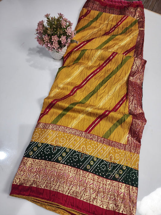 SAWAN LEHARIYA YELLOW COLOUR WITH FOIL AND DOLA CRUSH FABRIC BY SKFBHOLUBHAI
