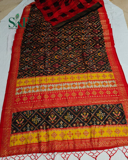 MAURA SILK PATOLA FOIL PRINT WEAVING BLACK SAREE BY SKFBHOLUBHAI